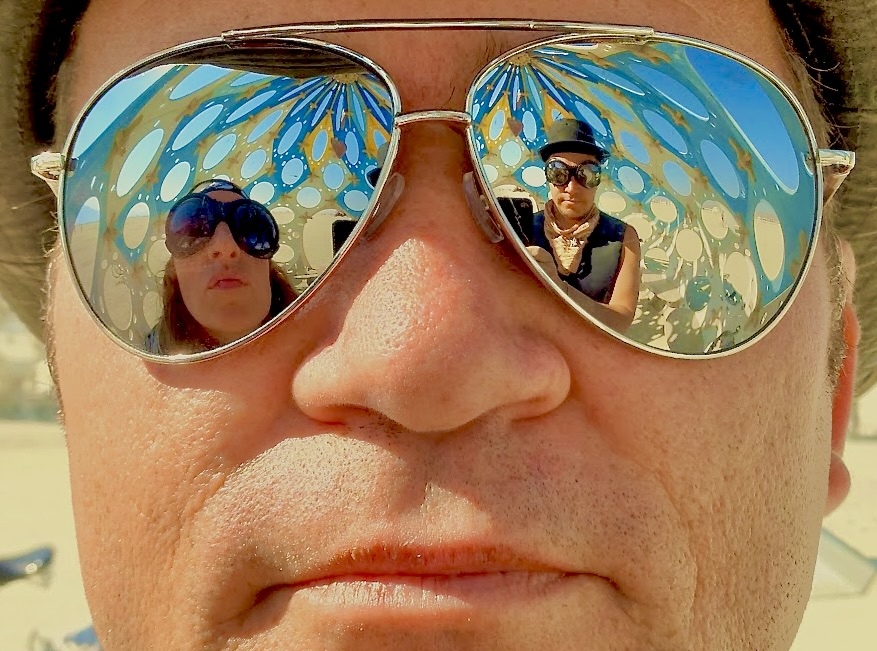 Josh the Fool at Burning Man — reflections in aviator sunglasses