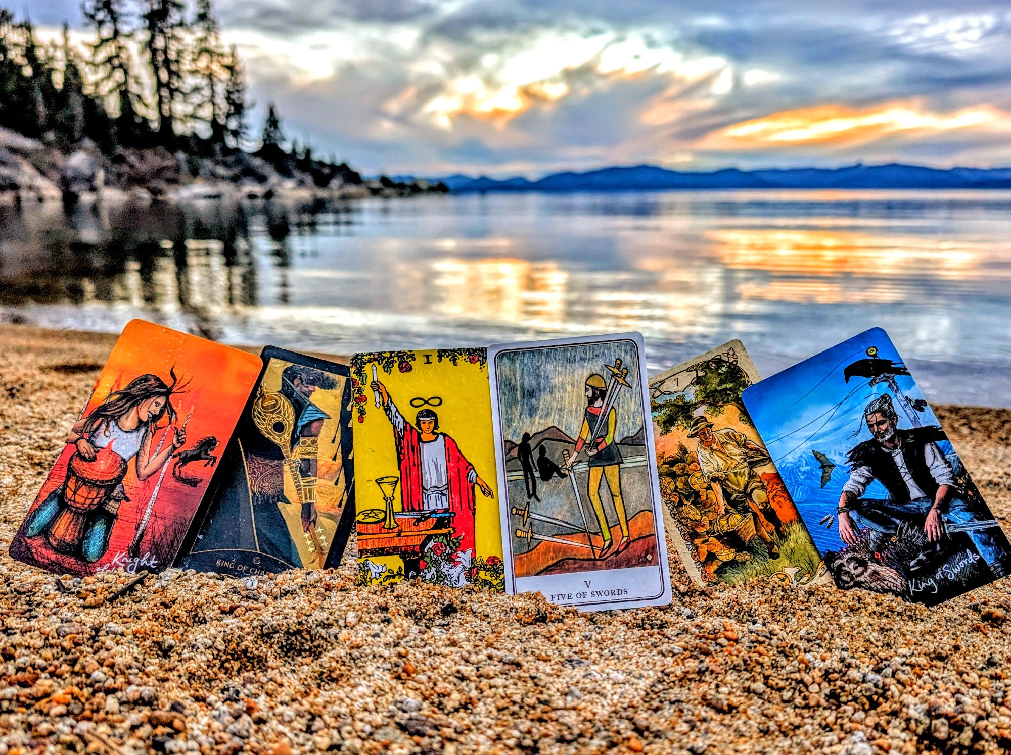 Tarot cards standing in the sand at Lake Tahoe sunset